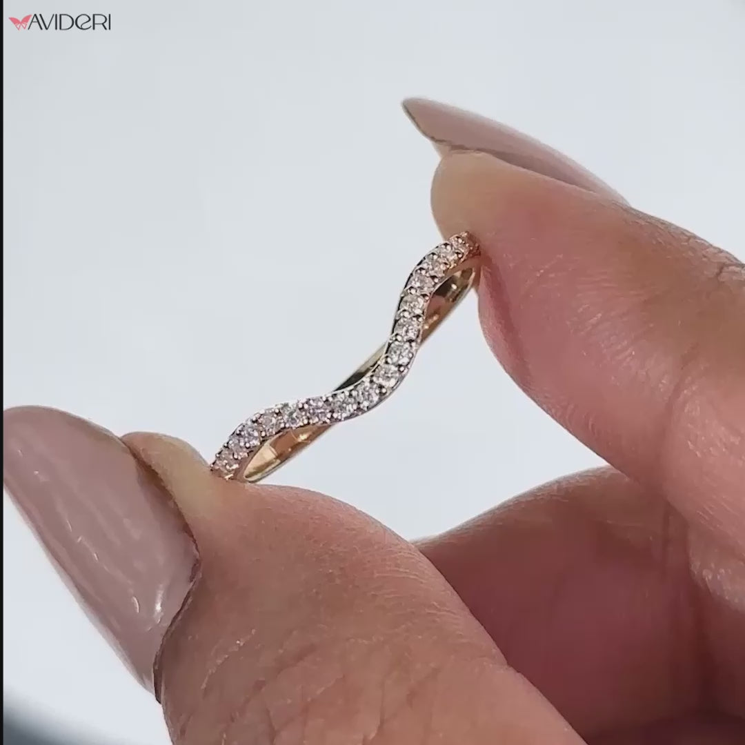 Elegant curved wedding band featuring a unique, timeless design.