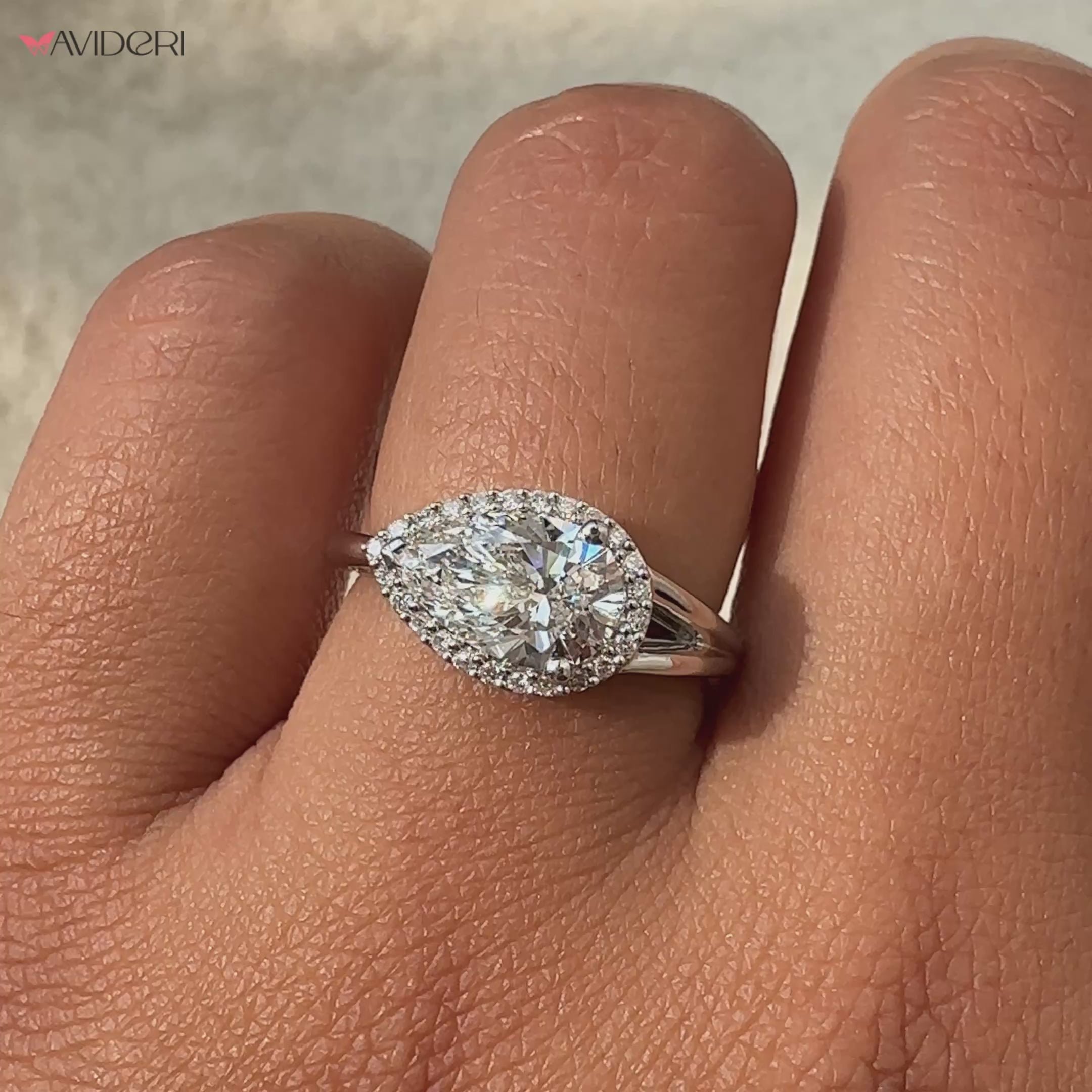 Pear shaped engagement ring with an IGI-certified stone.