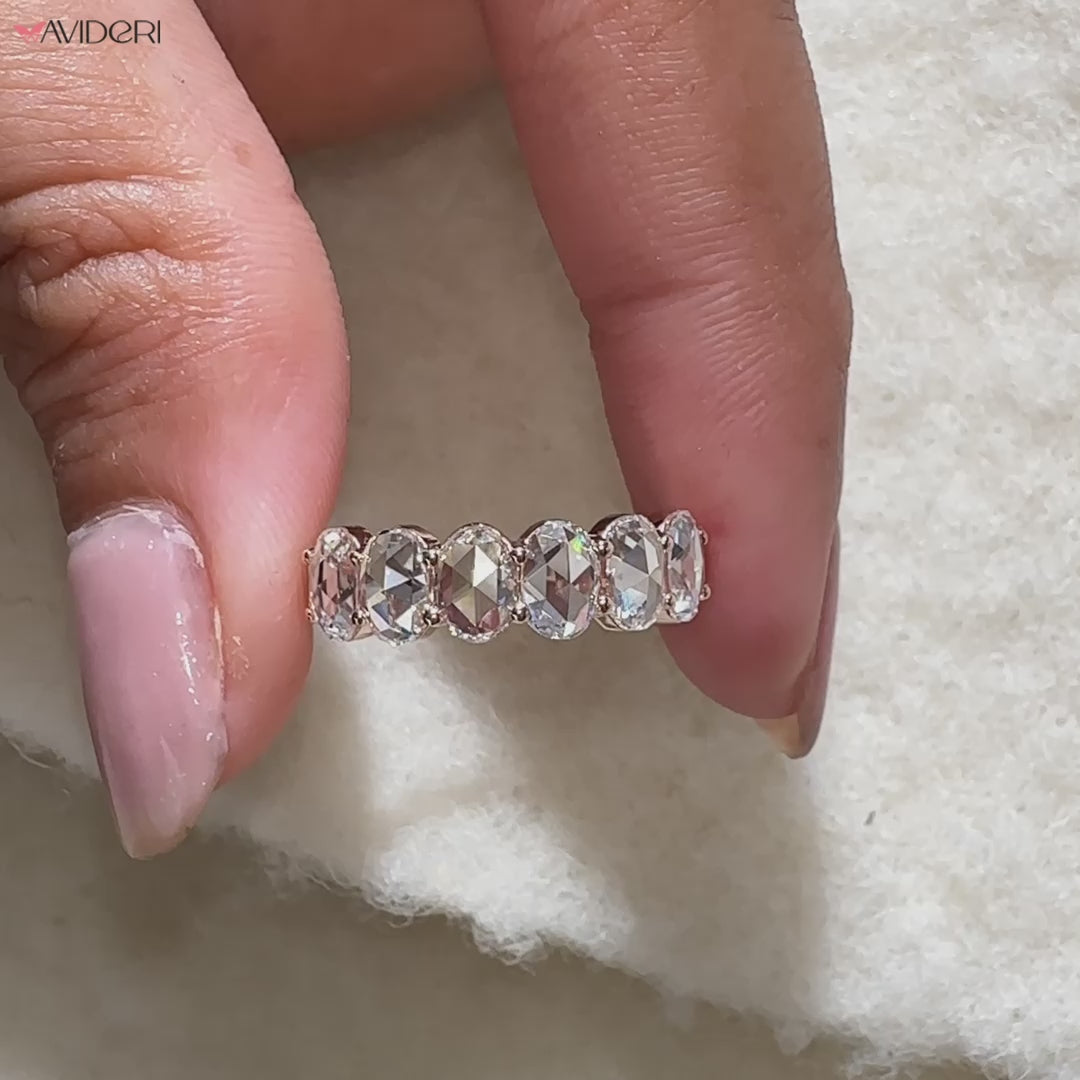 Oval rose cut six stone band crafted in rose gold.