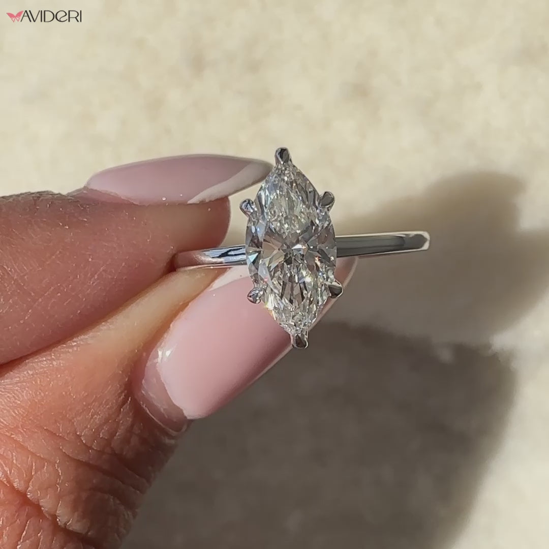 Avideri engagement ring with a marquise diamond center stone.