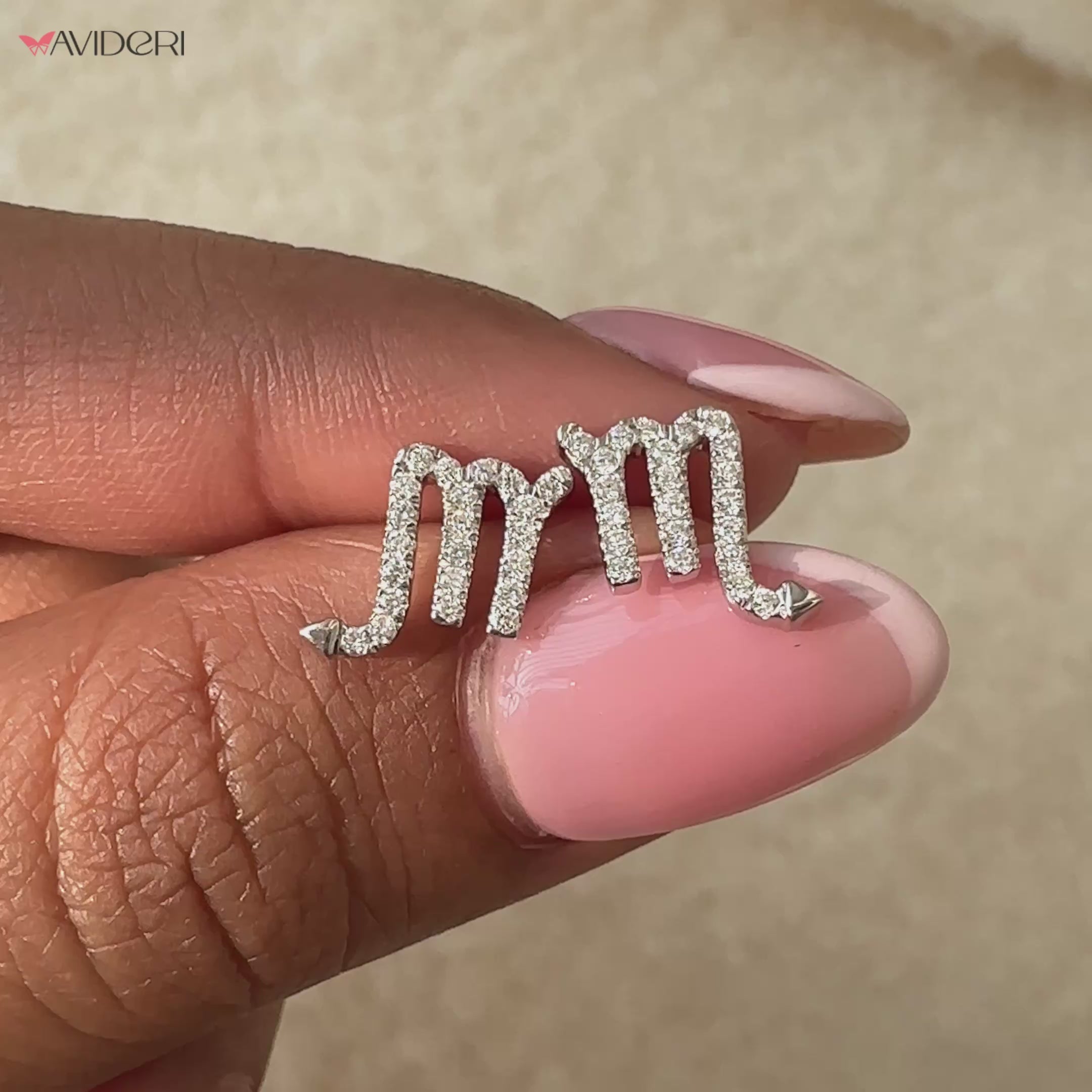 Scorpio zodiac sign earrings crafted in yellow gold