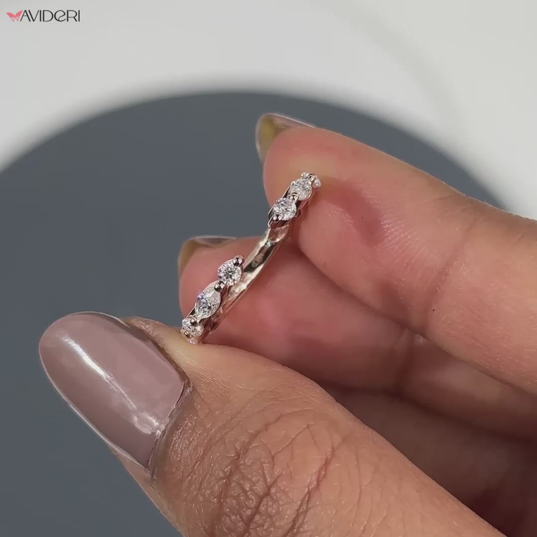 Marquise and round wedding band featuring lab-grown diamonds.