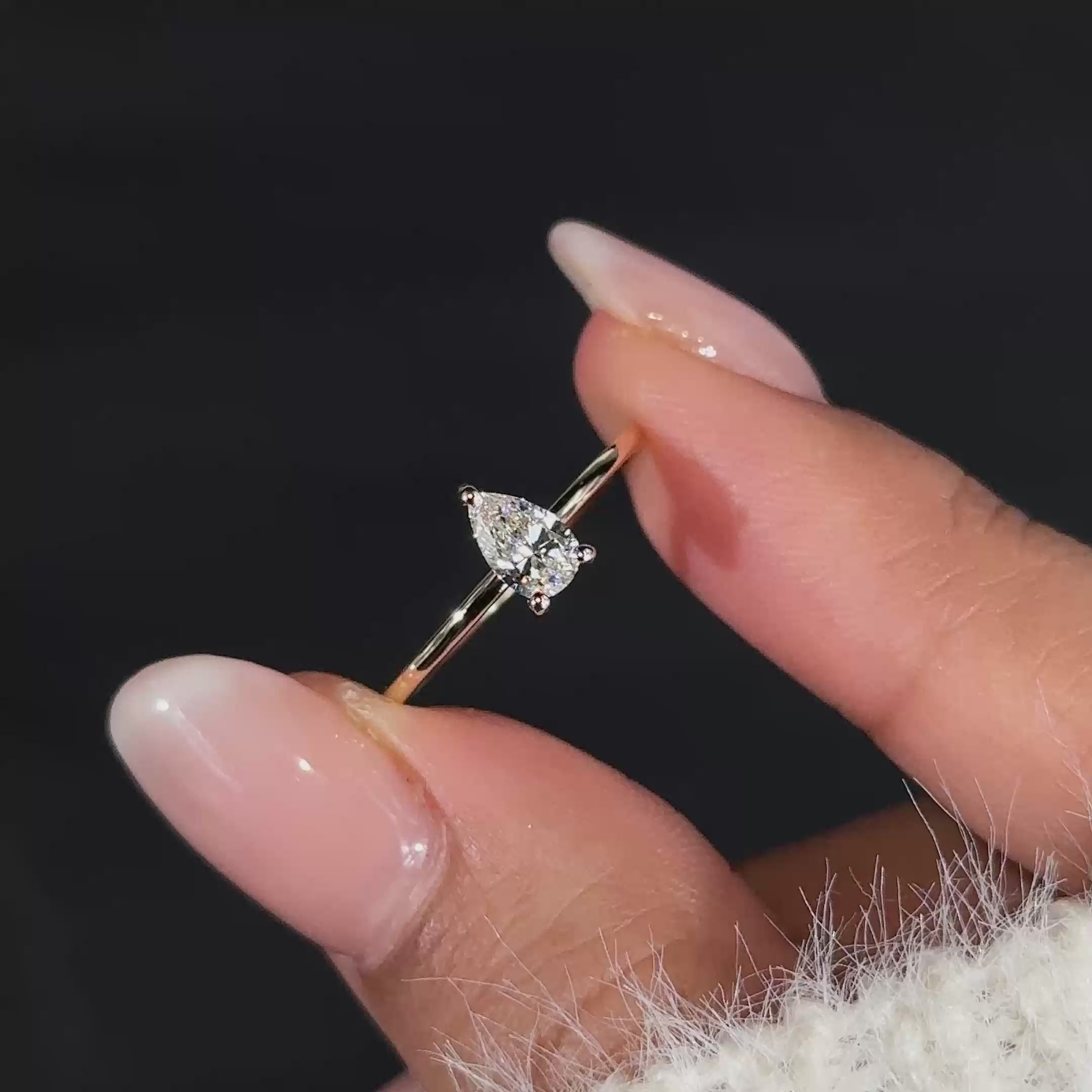 Elegant pear shaped diamond ring crafted for a timeless and luxurious look.