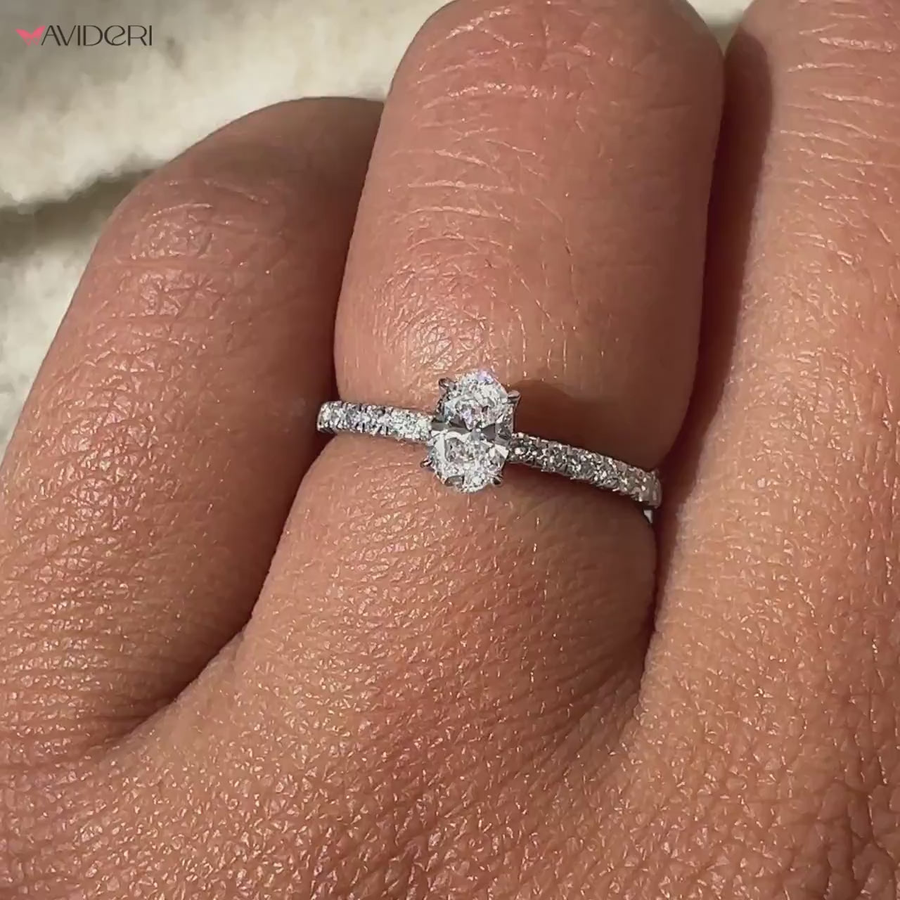 Oval diamond ring with a claw prong setting.