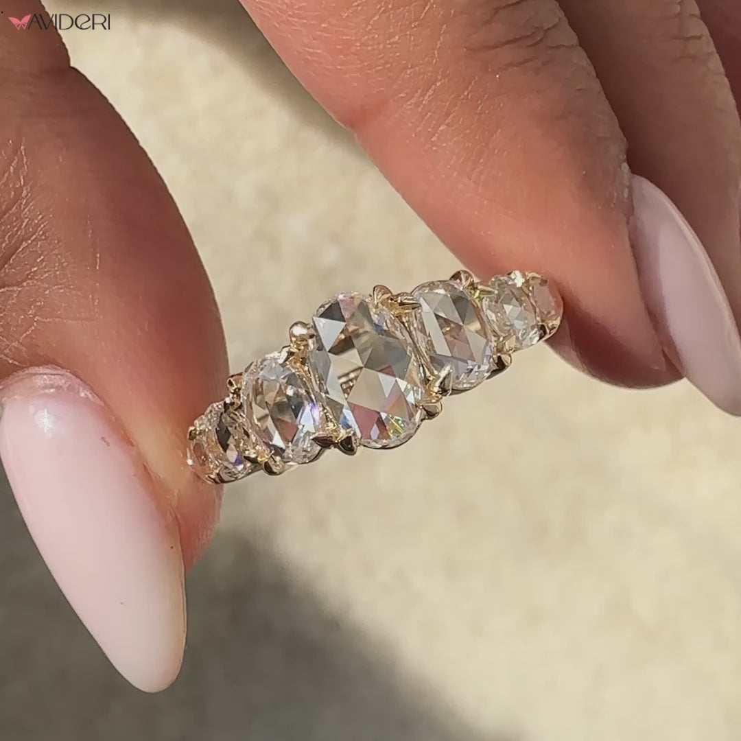 7 diamond wedding band featuring oval diamonds for a stunning design.