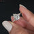 Pear shaped engagement ring with an IGI-certified diamond.
