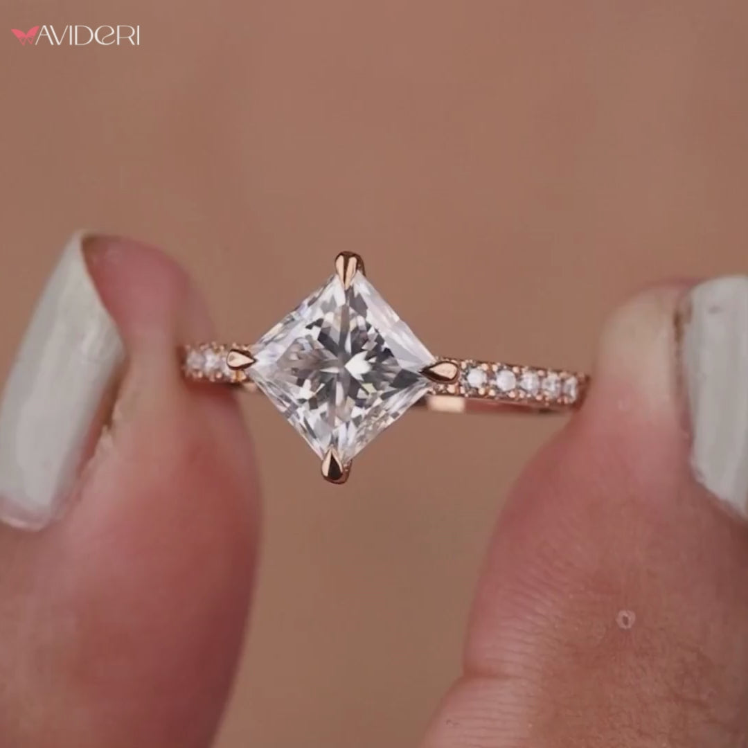 A ring with a compass prong setting holding the center stone.