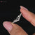 V-shape wedding band with sparkling diamonds.