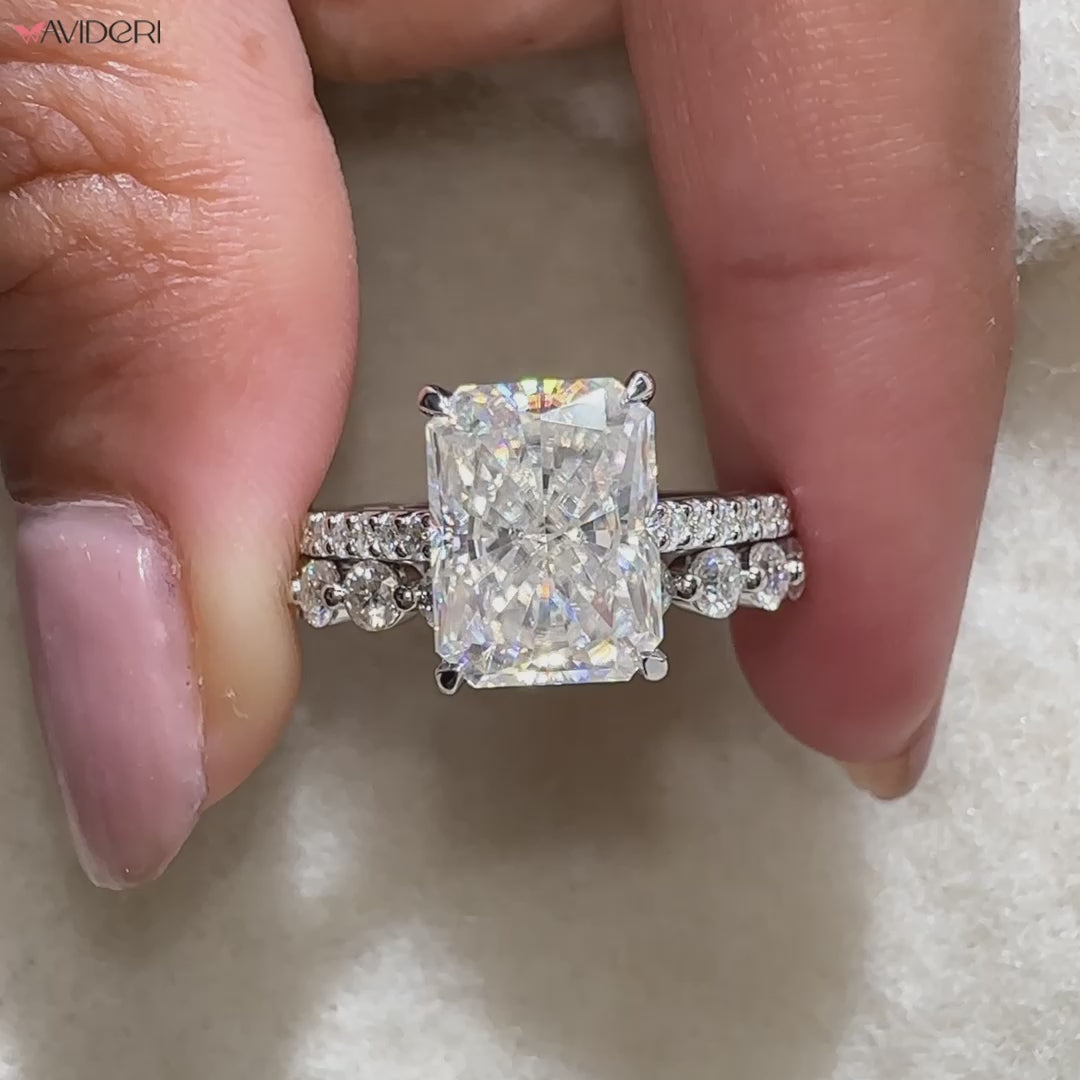 Elegant moissanite bridal set with radiant cut center stone.