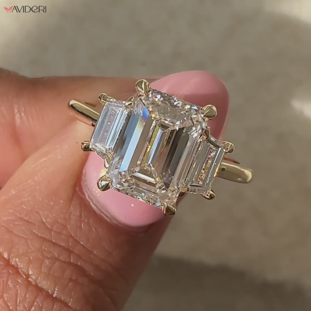 Emerald and diamond ring set in a beautiful emerald cut diamond ring for brilliance.