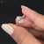 Cathedral style engagement ring crafted with a unique oval diamond, blending tradition and modern artistry.