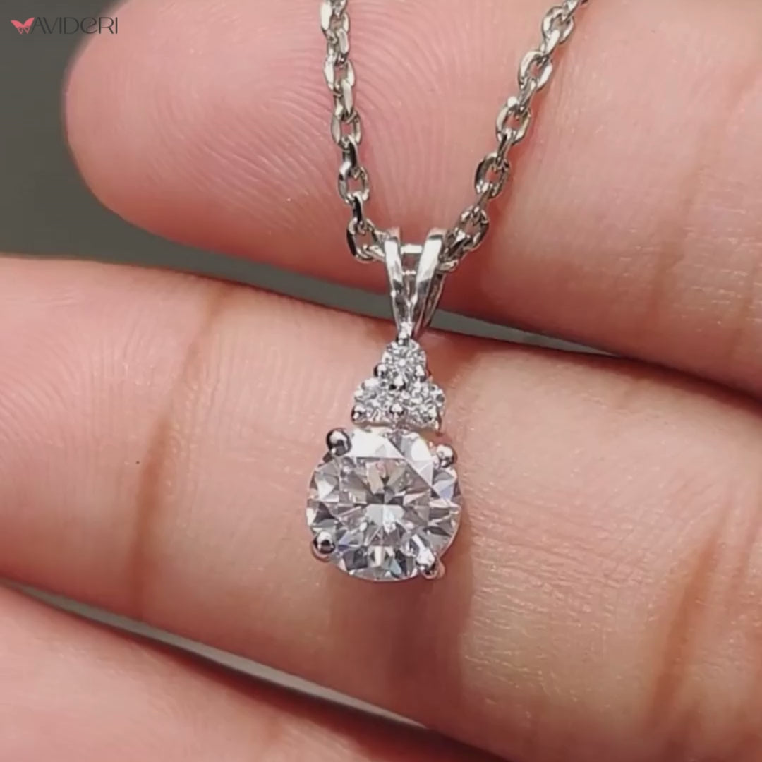 Handmade pendant featuring a round cut moissanite stone for a chic look.
