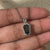 Coffin pendant with a custom moissanite pendant for elegance.
