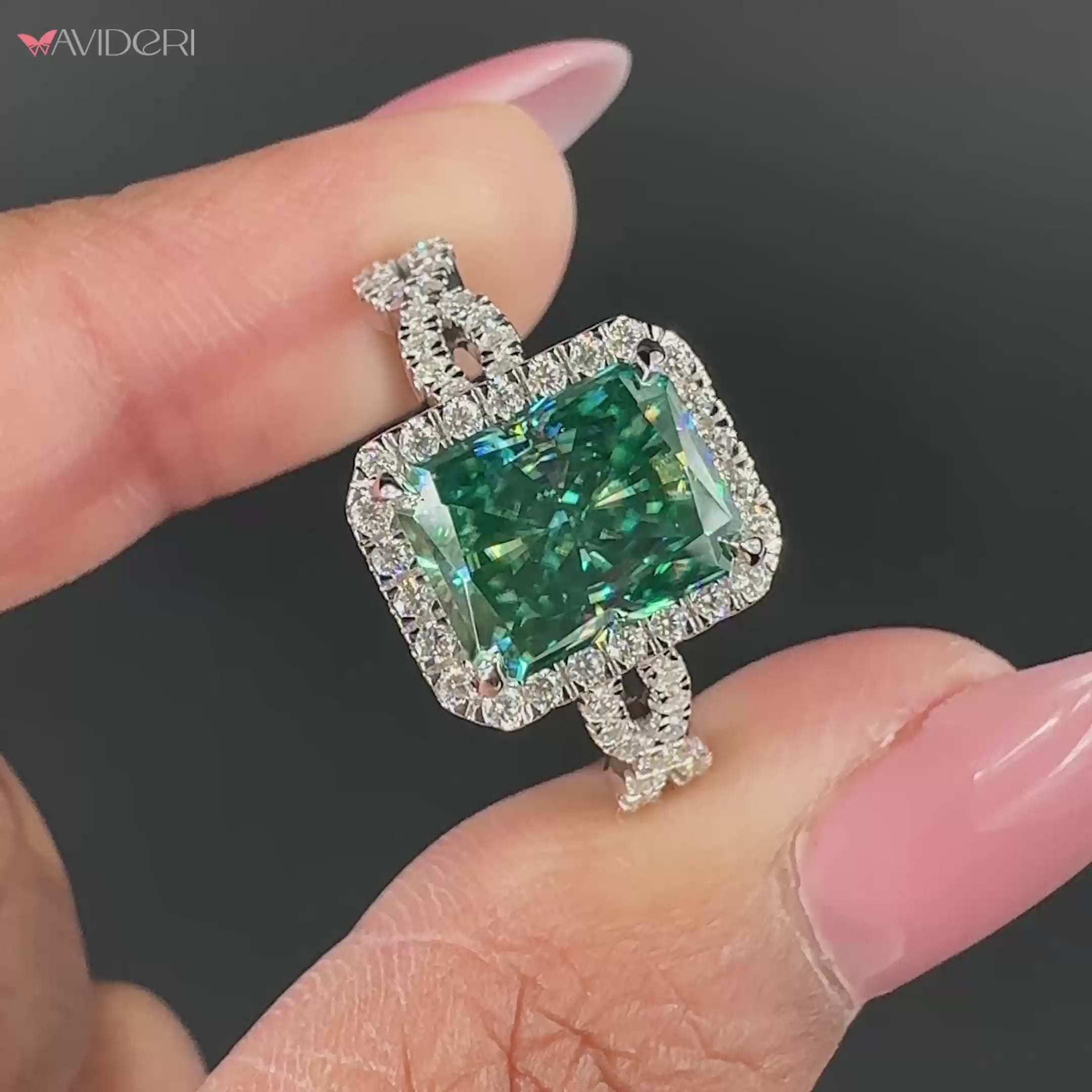 Elegant cyan blue moissanite ring set in a twisted band engagement ring.