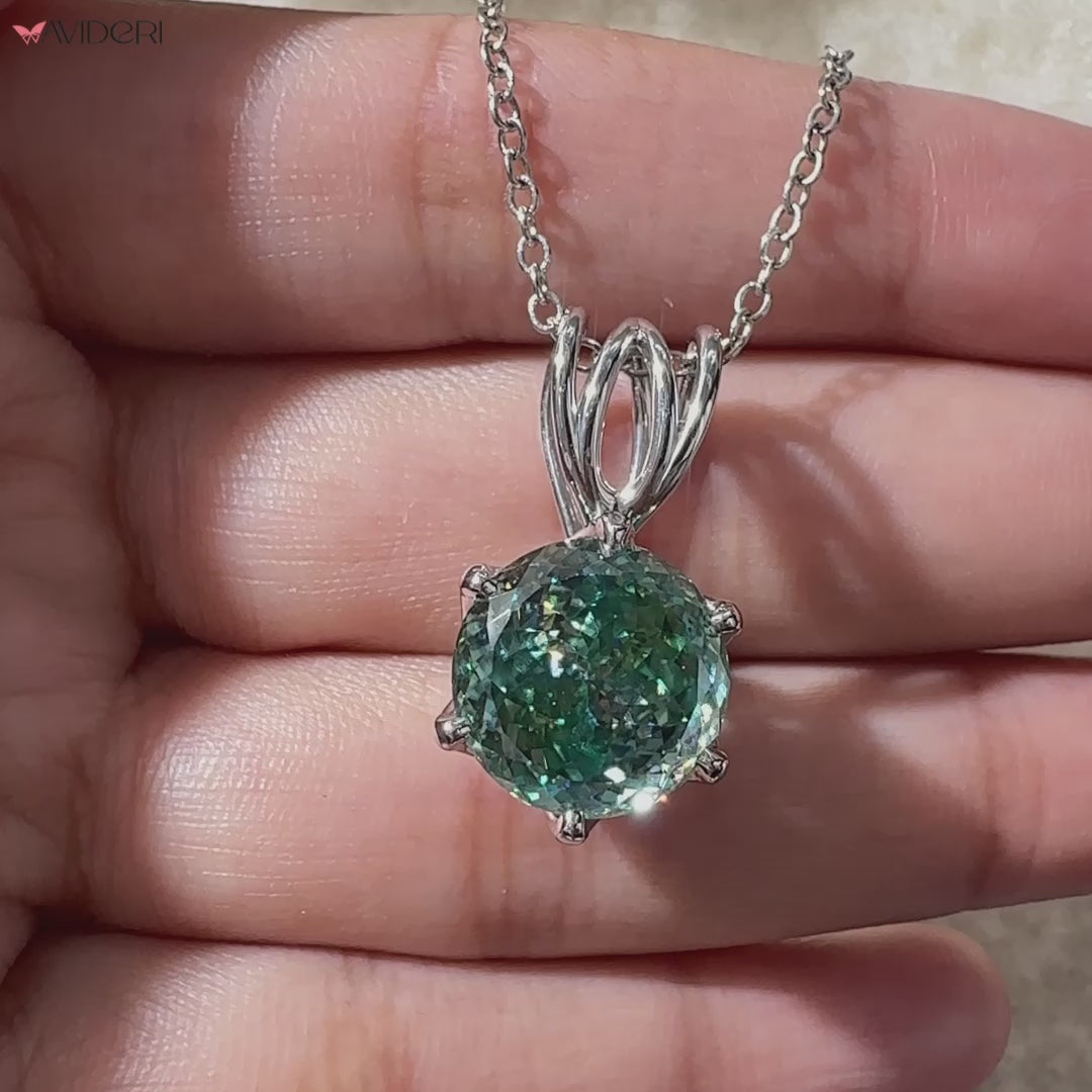 Handmade pendant in white gold with a soft shine.