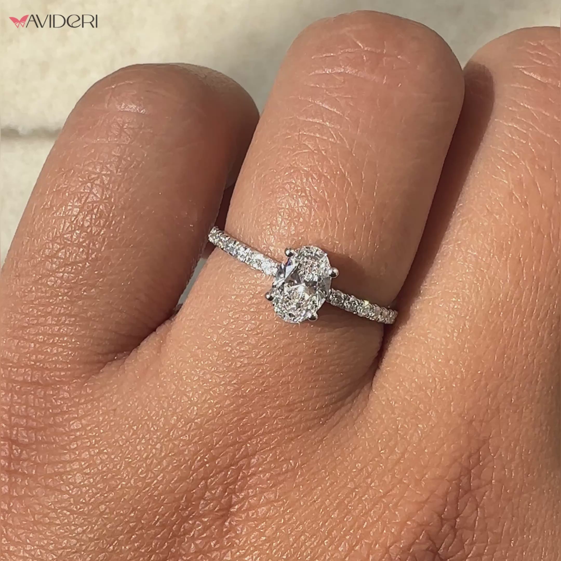 Pave setting ring featuring an elegant oval shaped engagement ring.