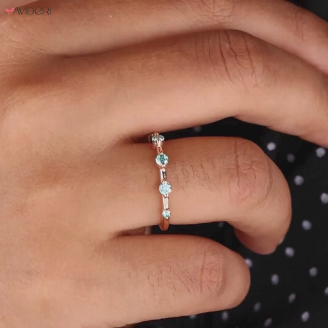 Moissanite gold wedding band pairs moissanite stones with the warmth of gold for a luxurious finish.