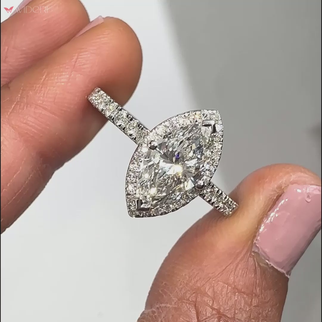 Elegant marquise halo ring with a timeless design, showcasing brilliance and sophistication for special occasions.