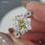 Round brilliant cut moissanite ring sparkles with perfect symmetry and clarity.