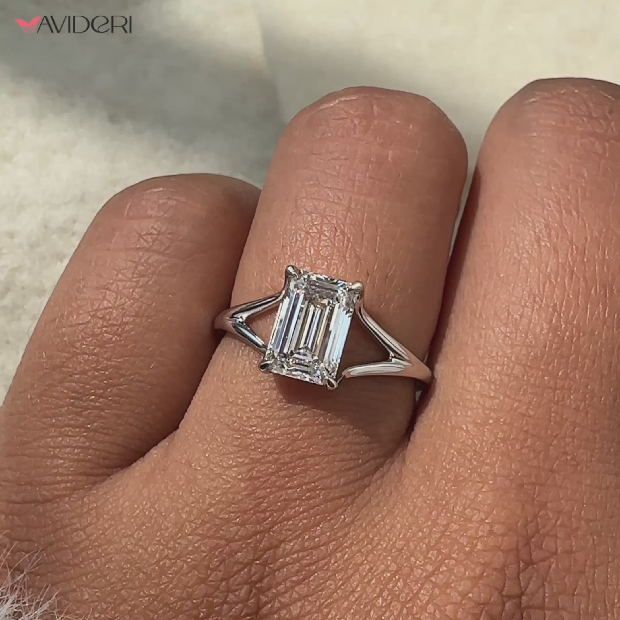 Emerald Cut Engagement Ring crafted with an IGI certified diamond in a split shank ring style for added brilliance.