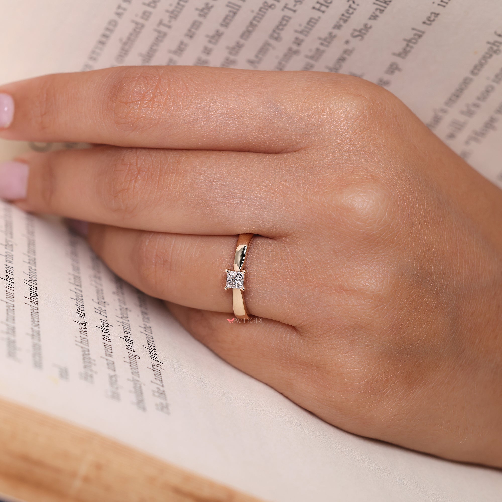 Princess diamond ring with a yellow gold band, offering a classic and durable design.