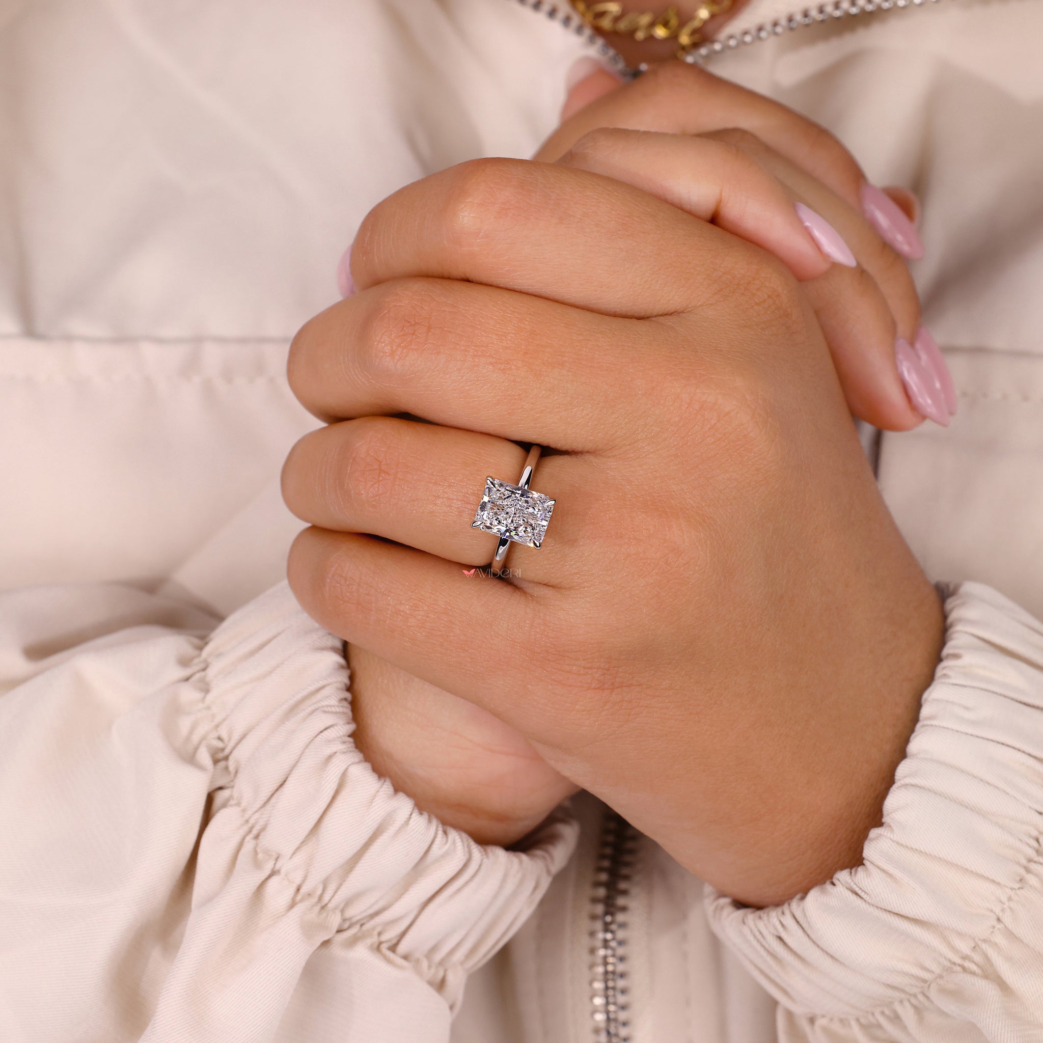 Prong setting ring designed to enhance the diamond's natural brilliance.