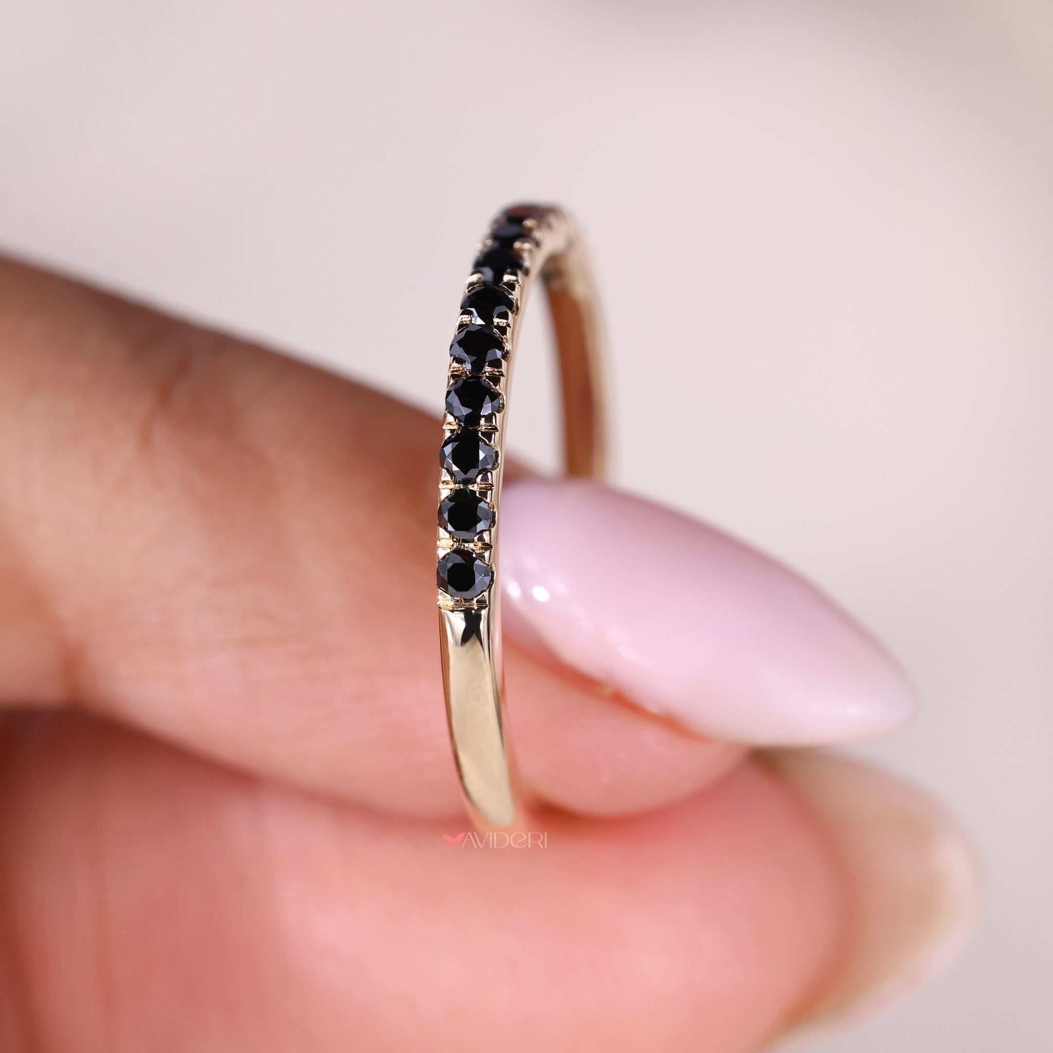 Prong setting with a round eternity band in a Yellow gold band for style.