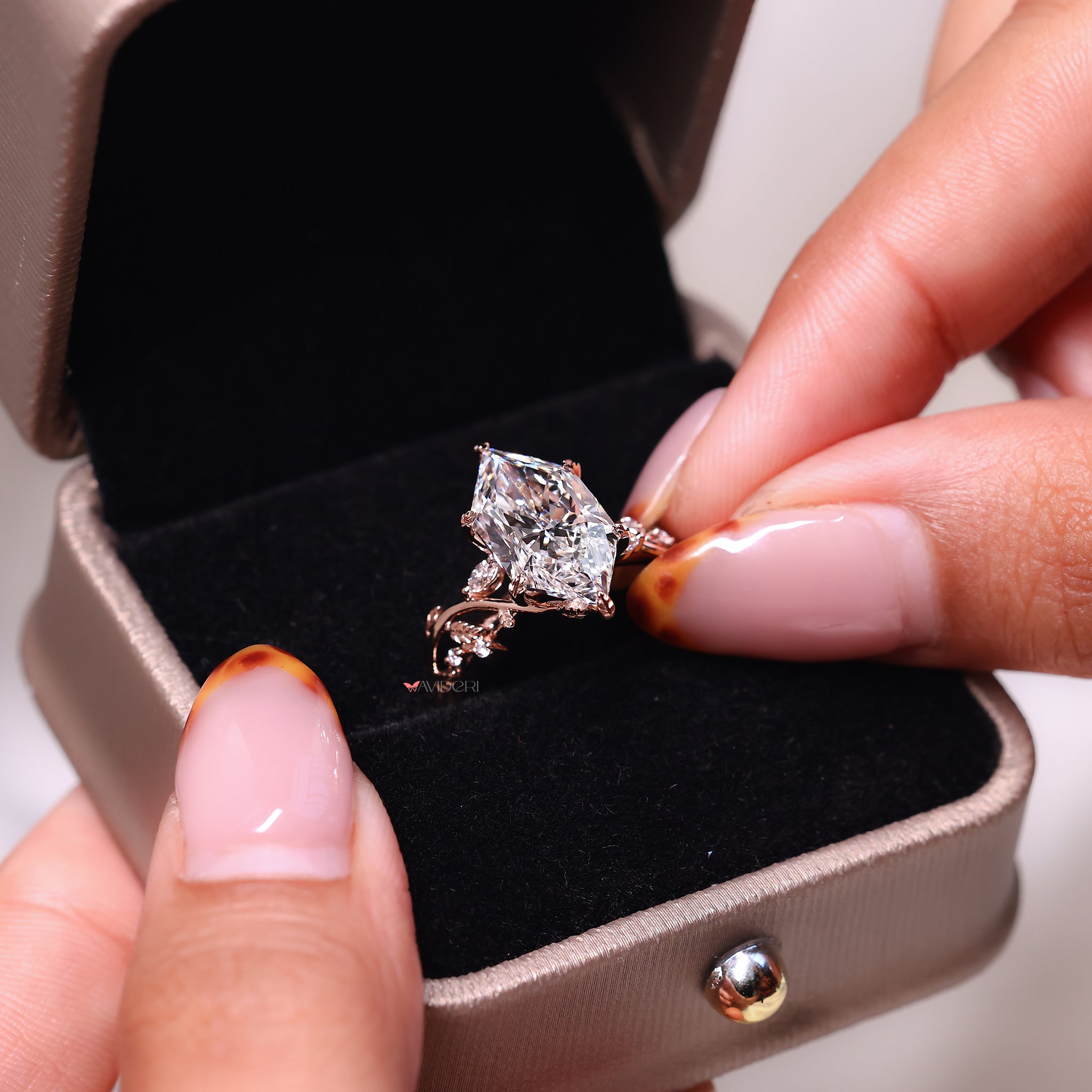 Rose gold ring featuring a unique engagement ring with Dutch marquise diamond accents.