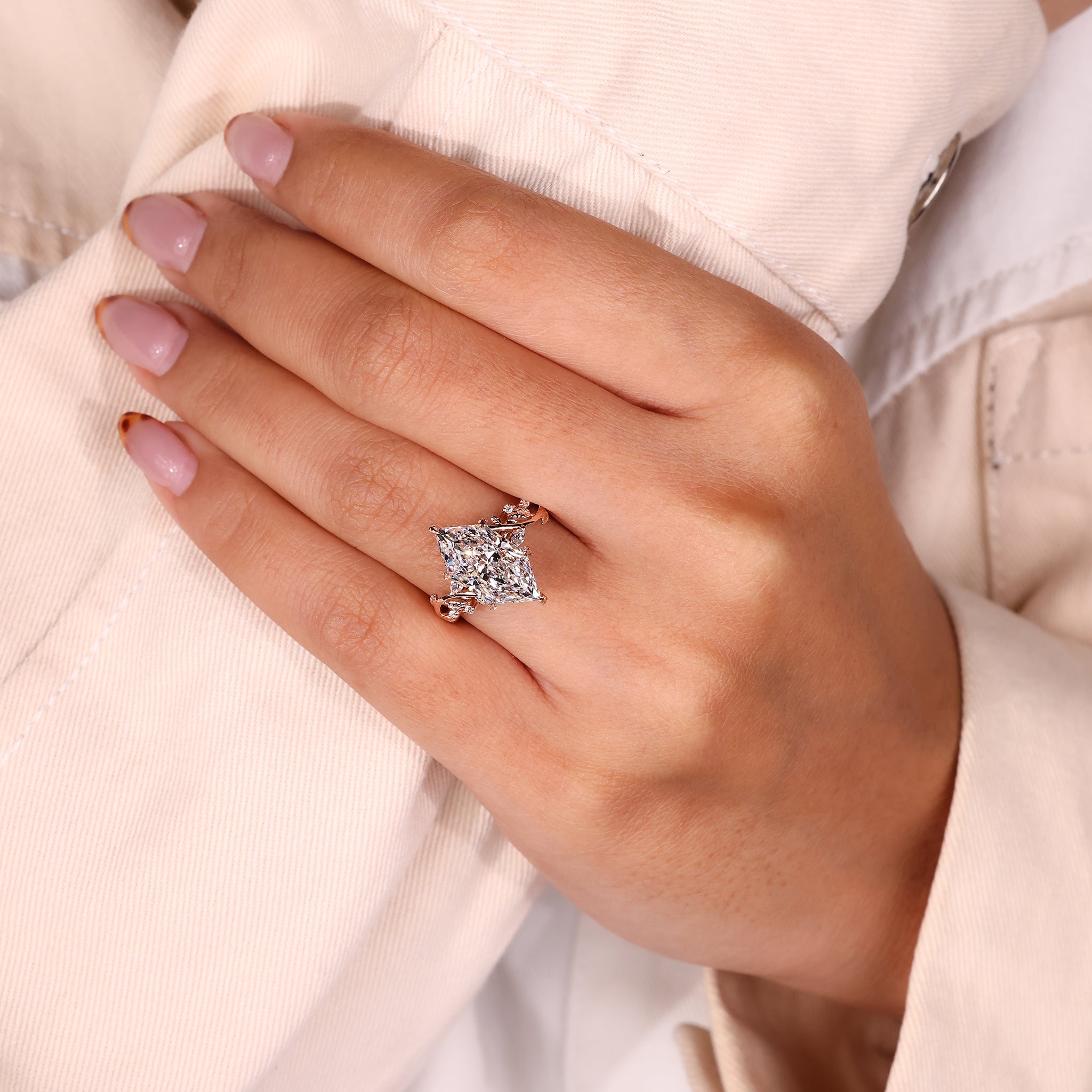 Dutch marquise diamond in a unique engagement ring with marquise and round side stones.