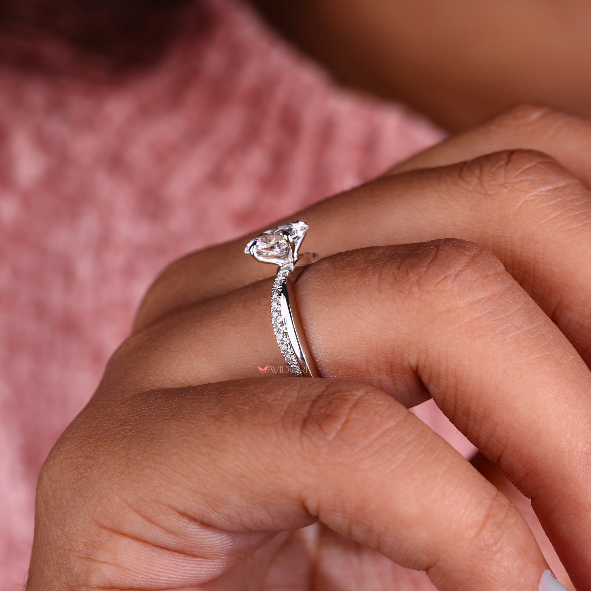 Handmade ring crafted with an oval engagement ring with twisted band and a four claw prong setting for extra durability.