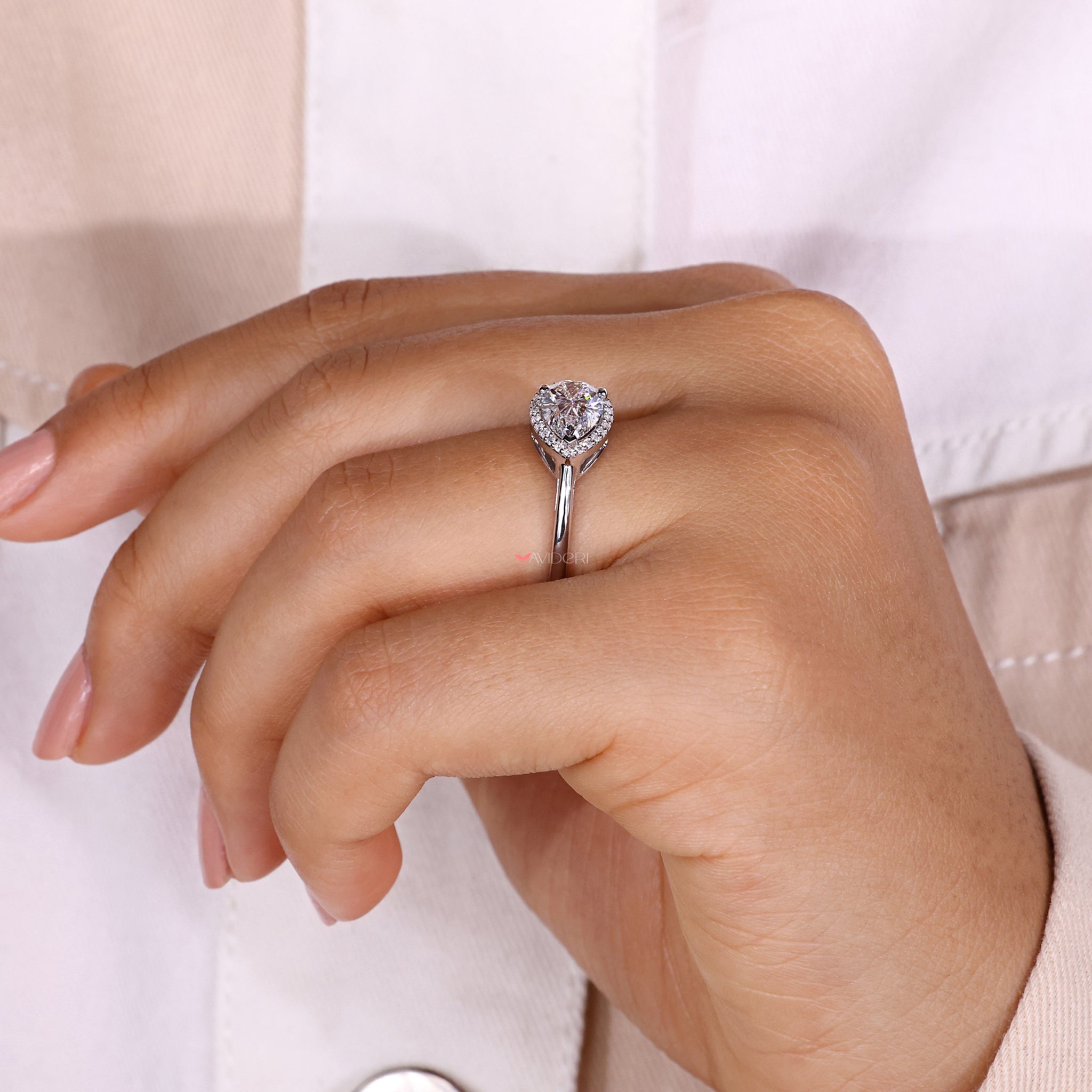 Pear cut engagement ring with a halo diamond engagement ring.