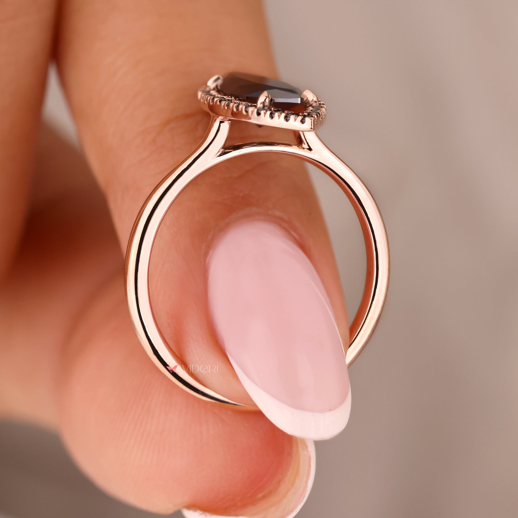 Rose gold engagement ring with a warm tone.