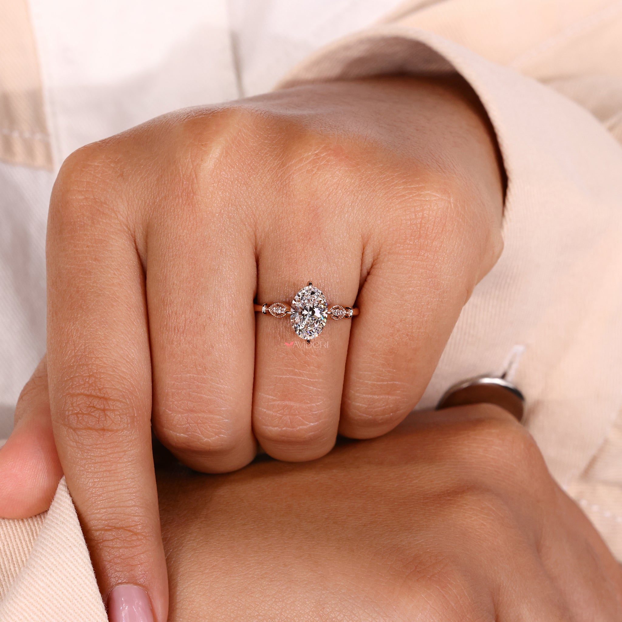 Round diamond set in a compass prong engagement ring with detailed