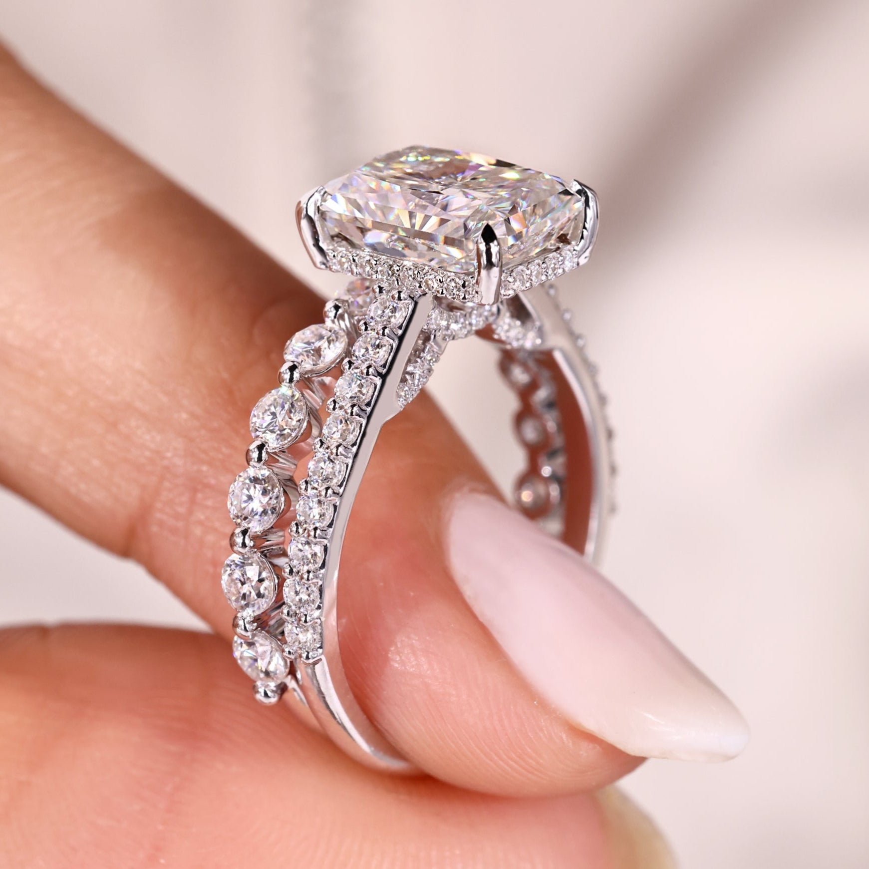 Radiant moissanite ring with matching eternity wedding band.