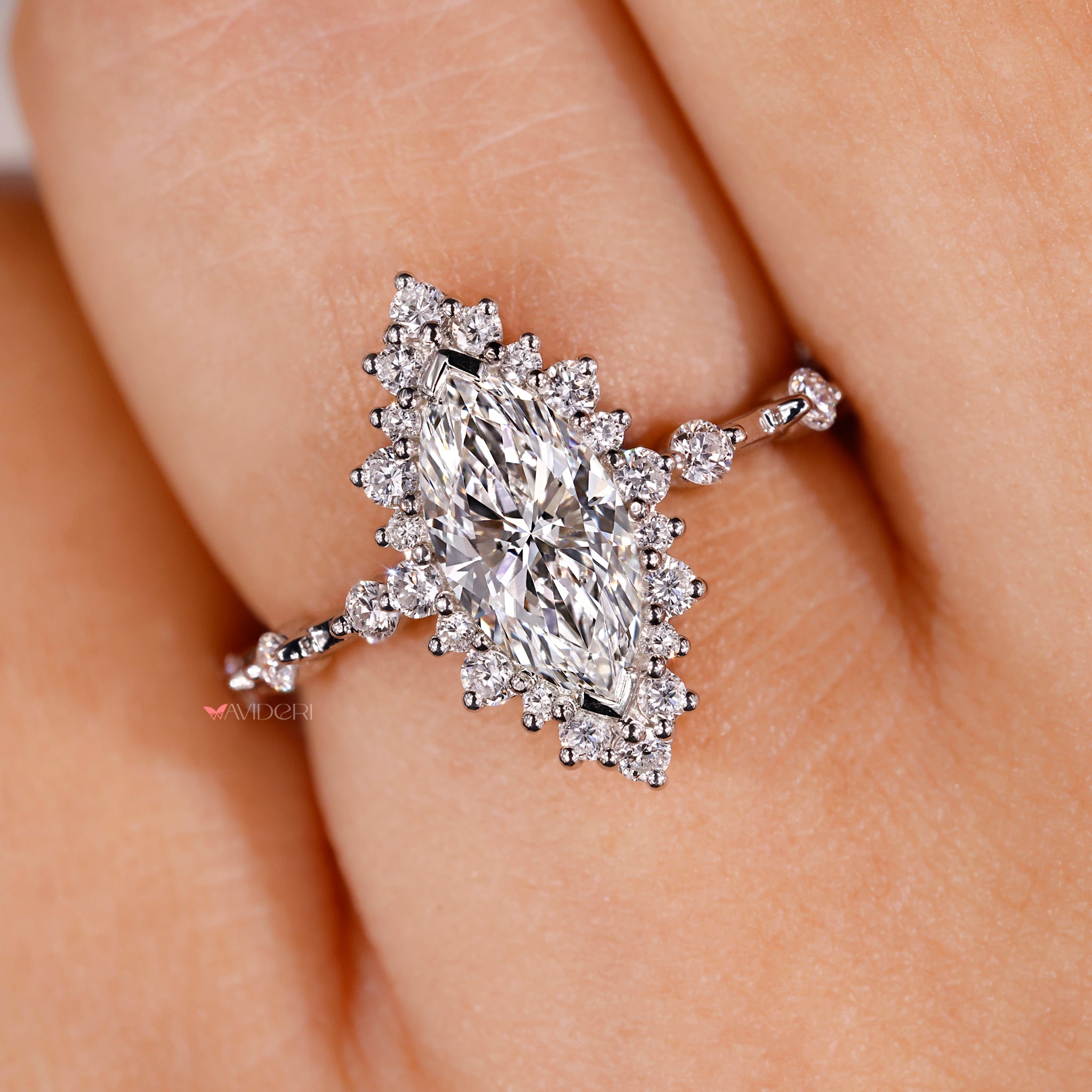 unique halo engagement ring with round and marquise lab grown diamonds.