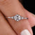 This 3 stone engagement ring features a stunning center stone flanked by two side stones.
 This 3 stone engagement ring features a stunning center stone flanked by two side stones.