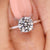 Round diamond ring with four prong setting and bridge accent. Round diamond ring with four prong setting and bridge accent.