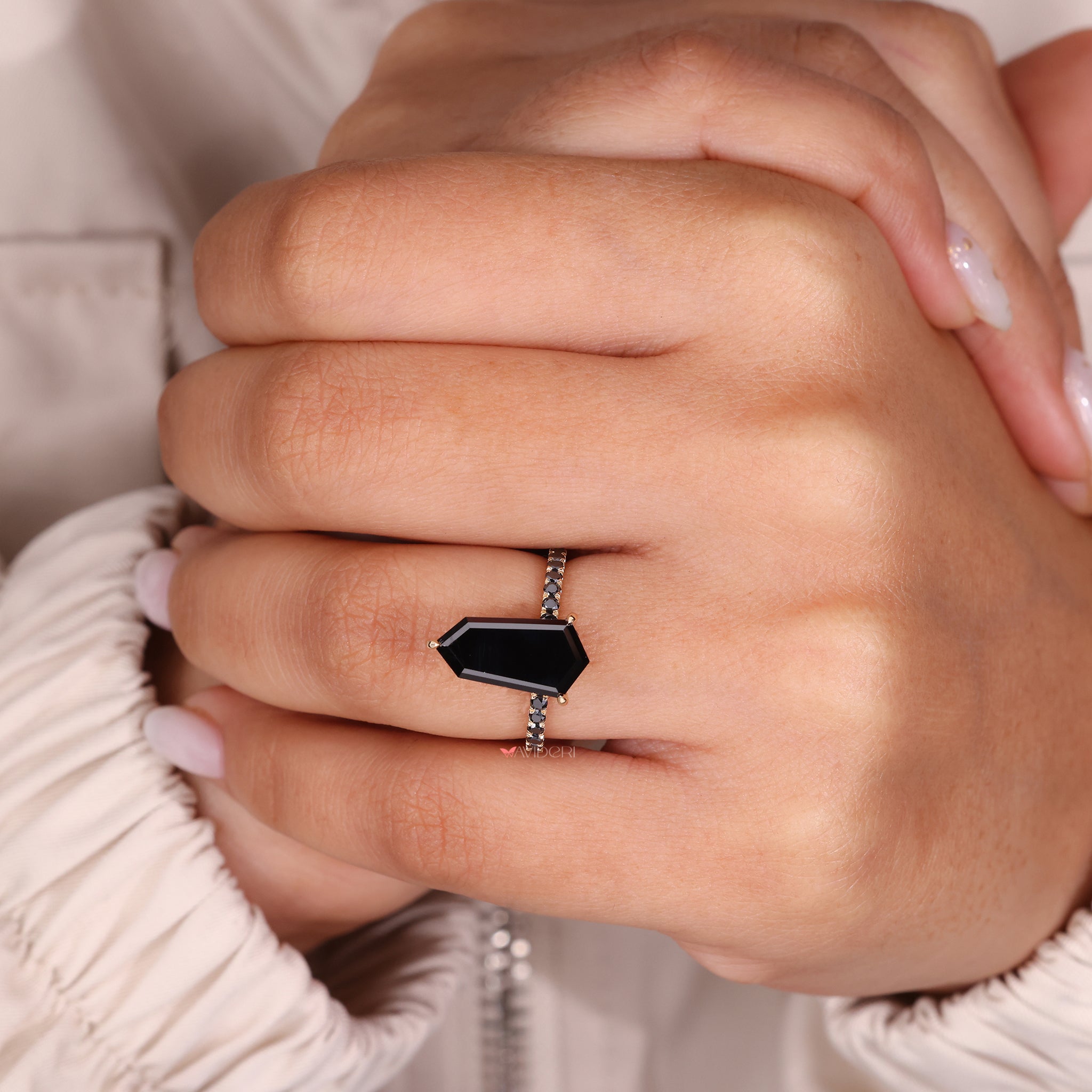 Moissanite bypass ring with an elegant and fluid band design.
