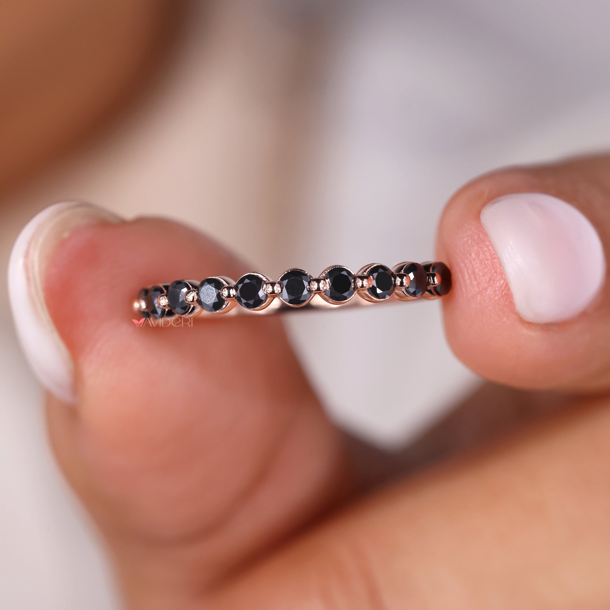 Shared prong band with moissanite stones in a half eternity wedding band.