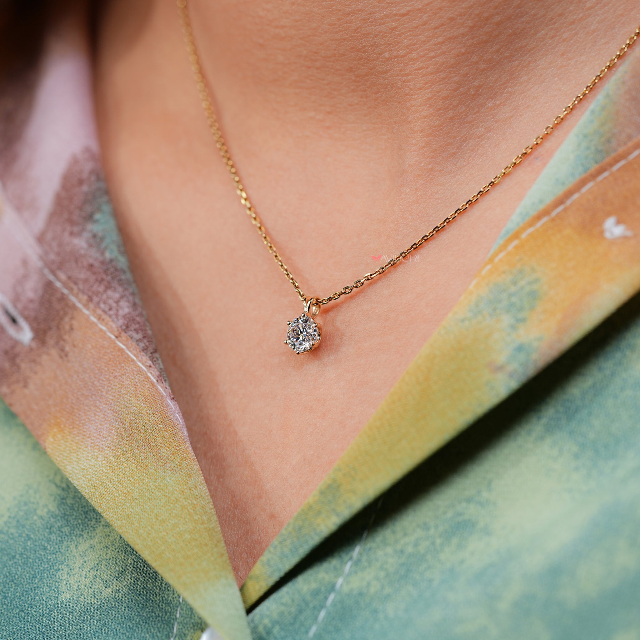 Yellow gold diamond pendant for a luxurious touch.