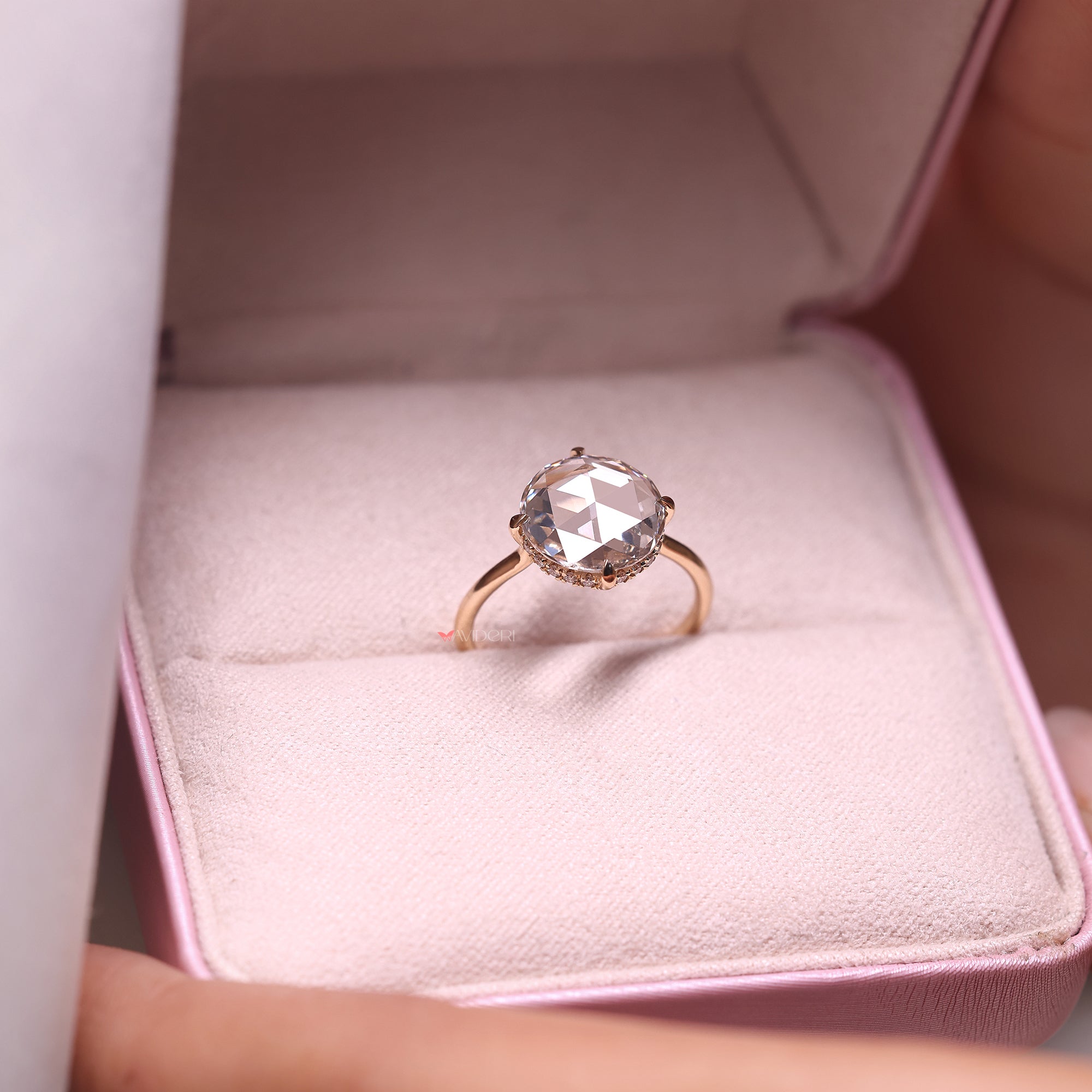 Round diamond hidden halo ring, designed for extra shine while maintaining a simple look.