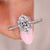 Oval diamond engagement ring with round side stones. Oval diamond engagement ring with round side stones.
