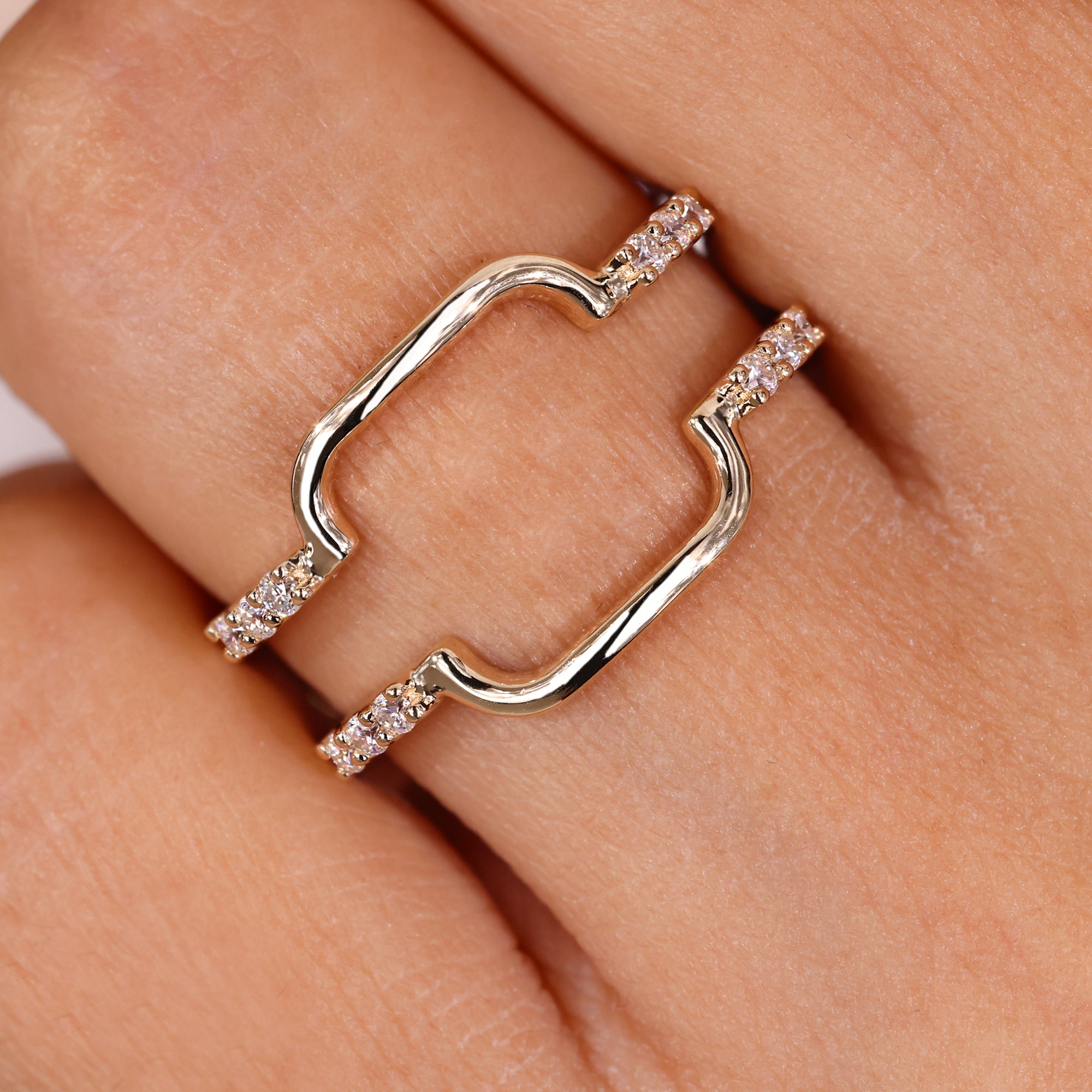 Round moissanite wrap guard wedding band in yellow gold.