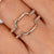 Round moissanite wrap guard wedding band in yellow gold. Round moissanite wrap guard wedding band in yellow gold.