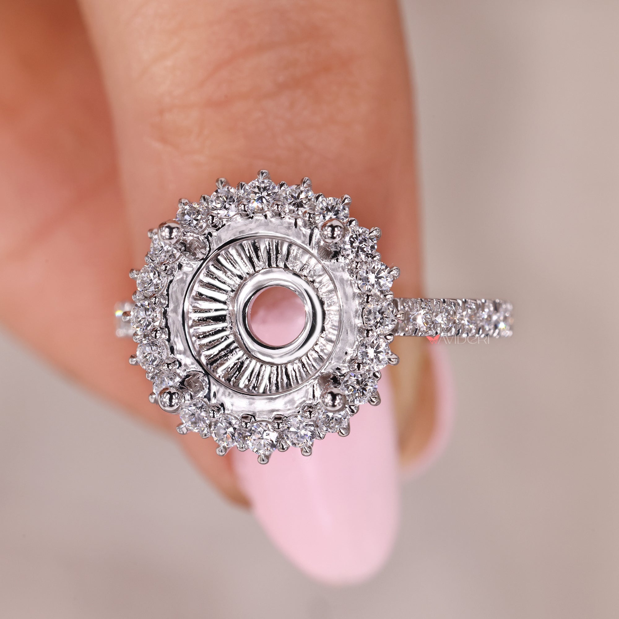 Cluster halo engagement ring with cathedral setting.