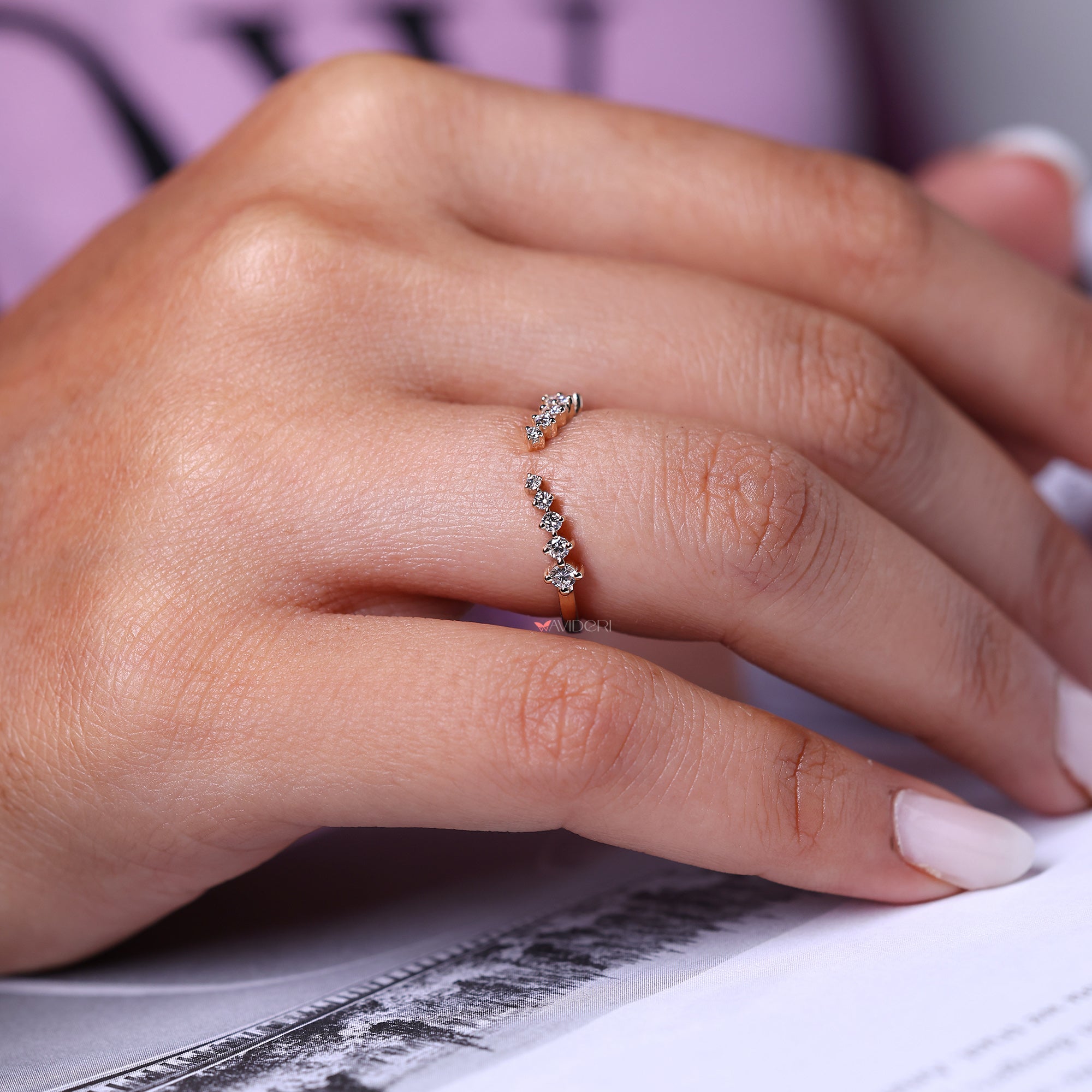 Custom round diamond wedding band with open curve.