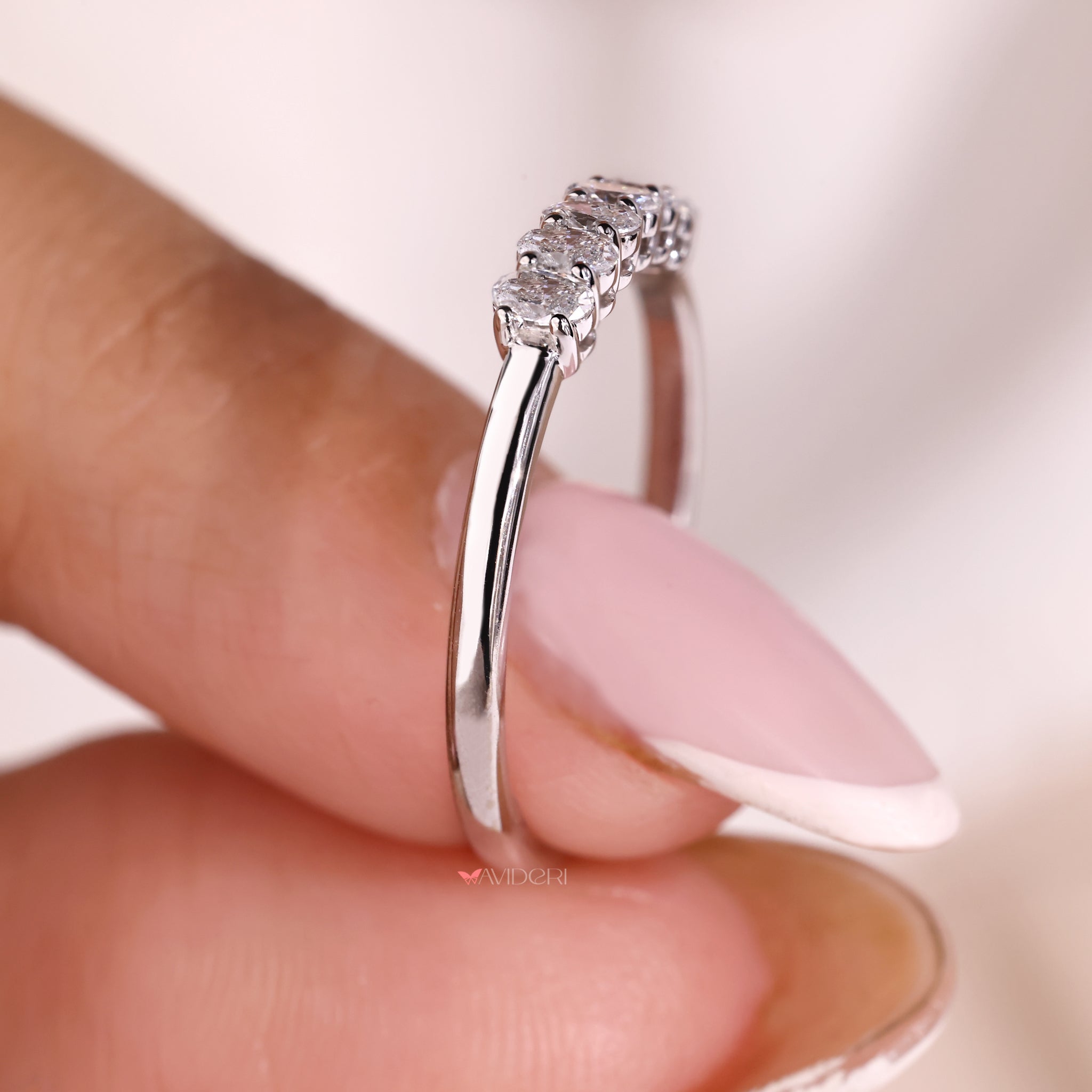 A white gold ring with a refined polished finish.