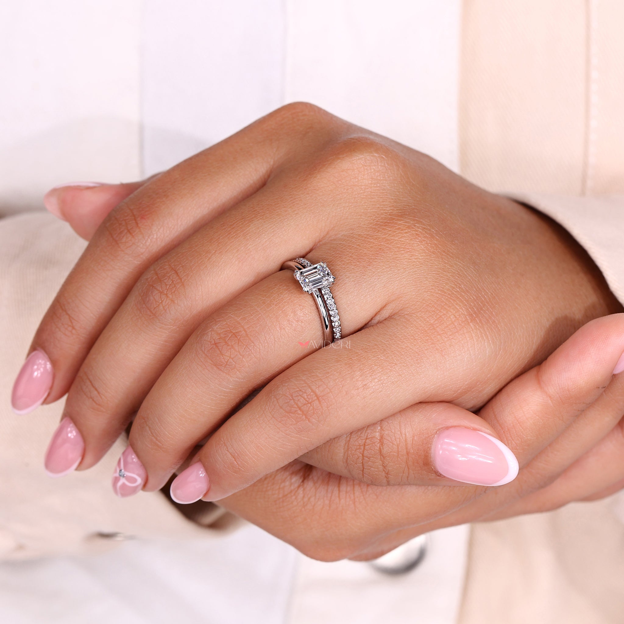 Solitaire ring featuring a classic and radiant emerald cut diamond