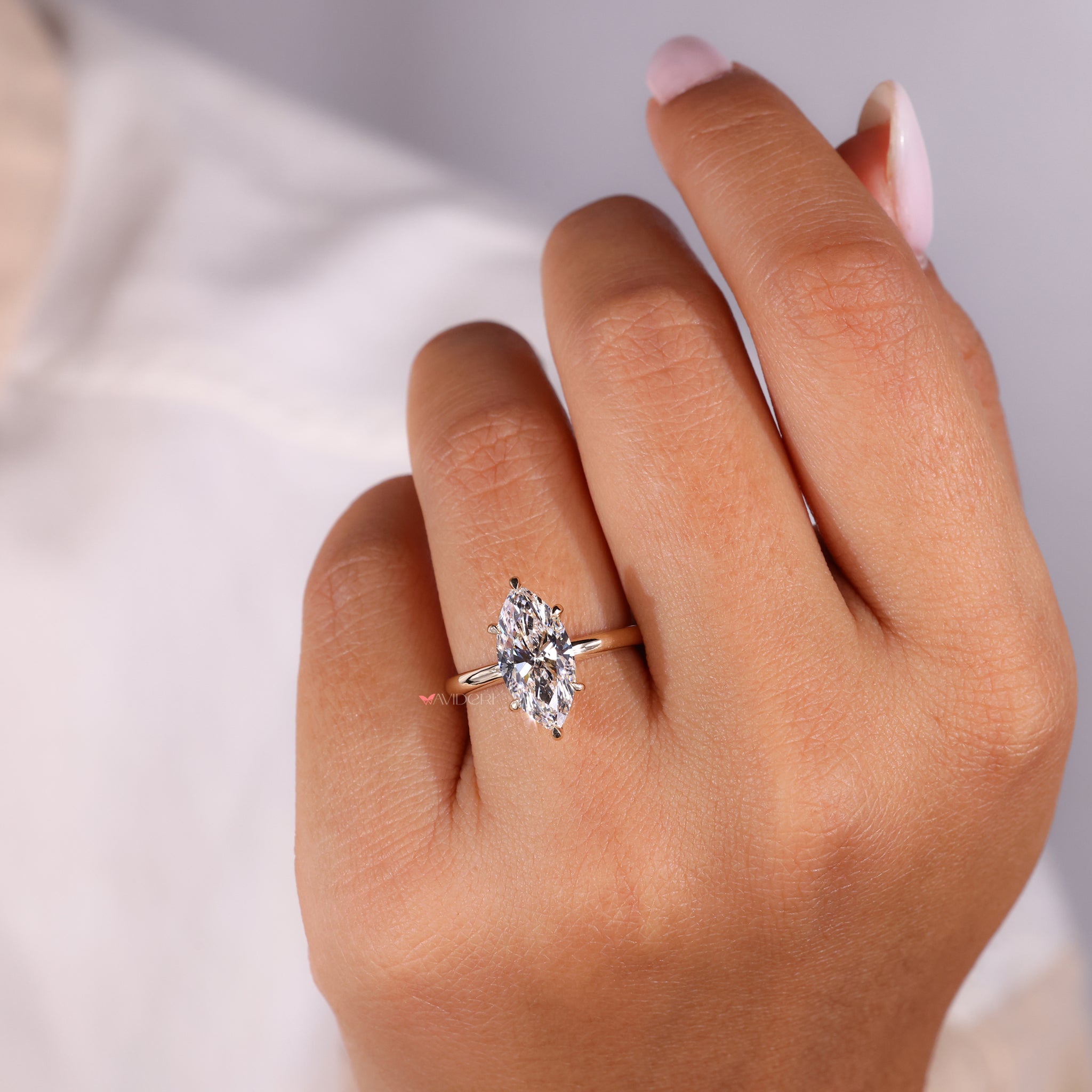 Avideri ring featuring a brilliant Marquise diamond for luxury.