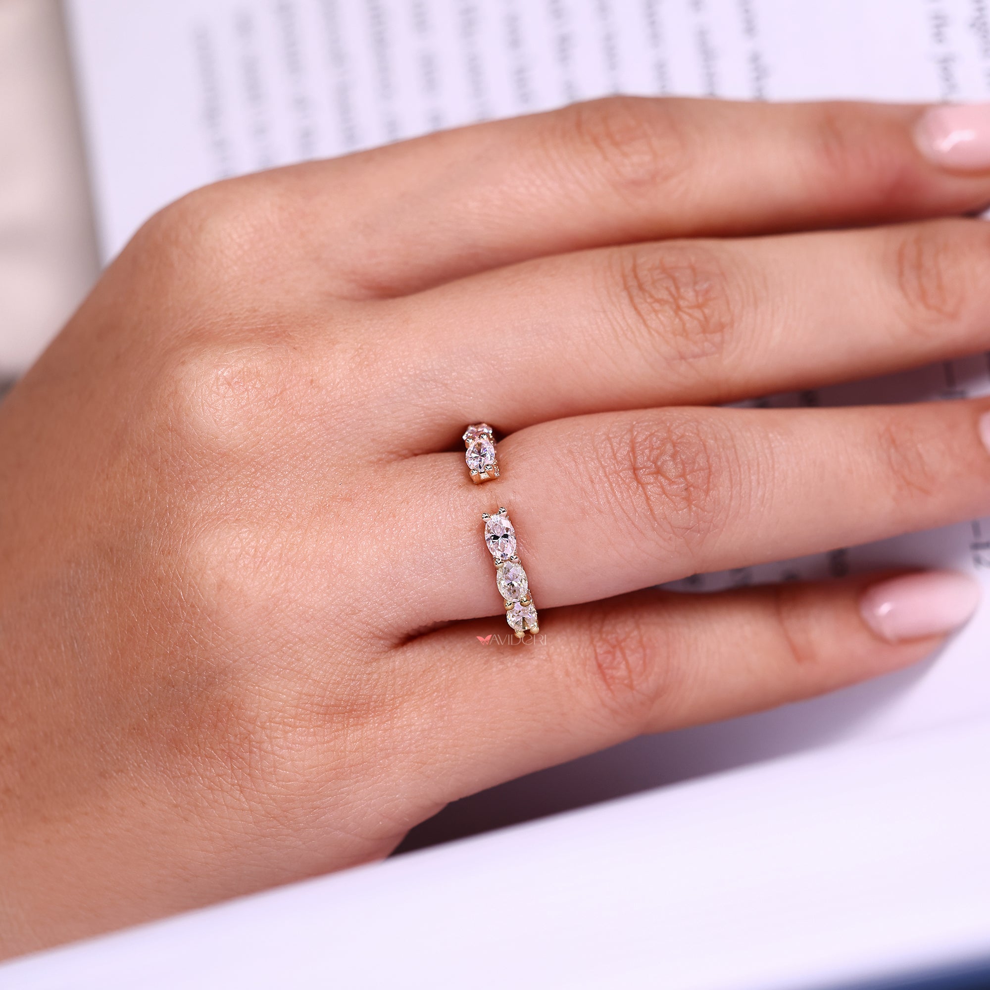 Open gap wedding band with oval cut wedding band.